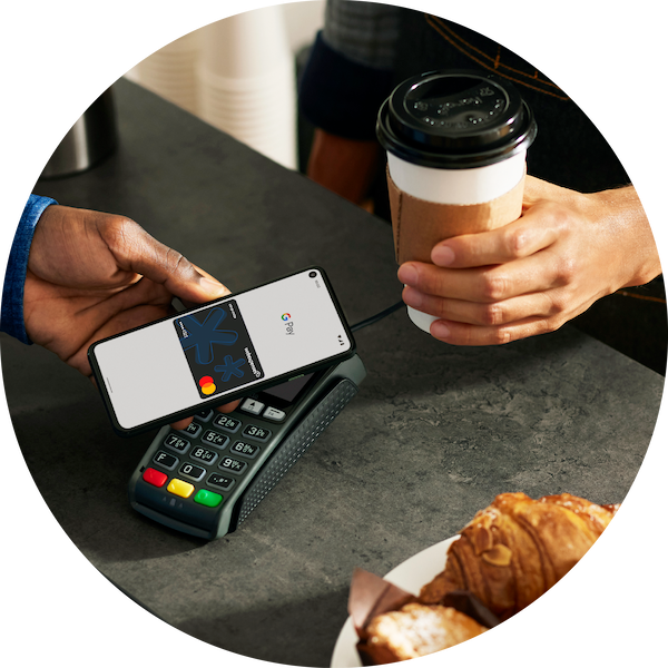 Google Pay Assets - Op 1 Someone using their Expense Card on Google Pay purchasing a coffee in a cafe