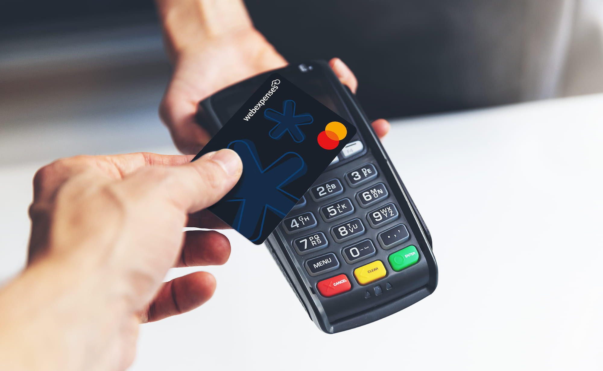 A person using one of our Corporate Cards to pay for goods.