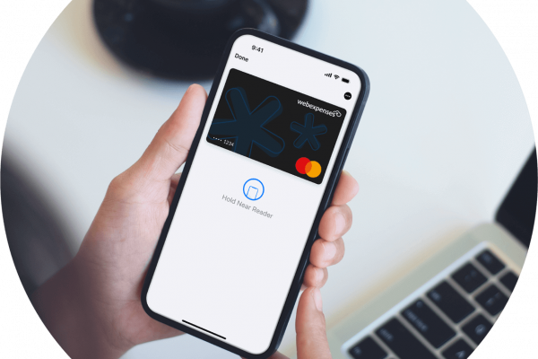 Person holding phone with Webexpenses Expense Card in their Apple wallet
